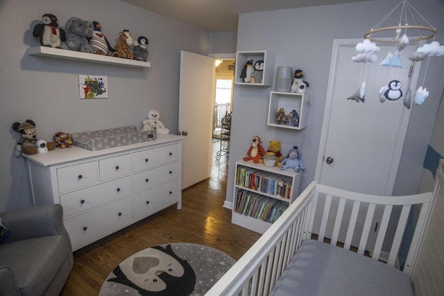 2563 S 91st St, West Allis, WI 53227 - bedroom featuring dark wood-style flooring, a chandelier, and a crib