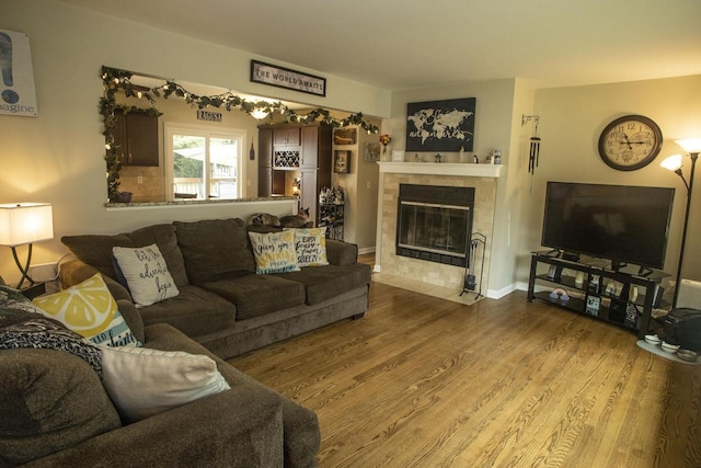 2563 S 91st St, West Allis, WI 53227 - living area featuring wood finished floors and a tile fireplace