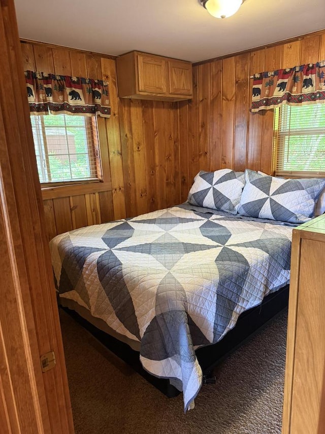 W6020 Northern Lights Cir Unit 7, Tomahawk, WI 54487 - carpeted bedroom featuring wood walls