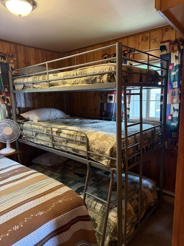 W6020 Northern Lights Cir Unit 7, Tomahawk, WI 54487 - bedroom featuring wooden walls and carpet