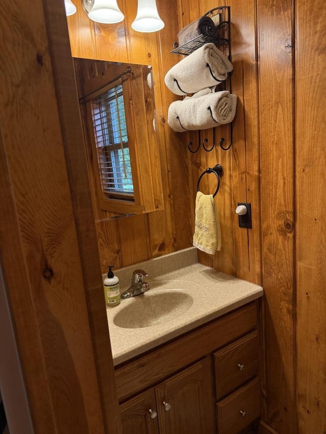 W6020 Northern Lights Cir Unit 7, Tomahawk, WI 54487 - bathroom with vanity and wood walls