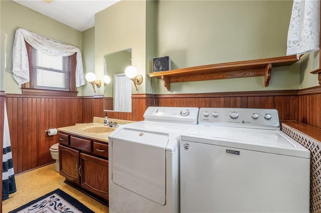 246 Coleman St, Chippewa Falls, WI 54729 - laundry area with a wainscoted wall, washer and dryer, and wooden walls