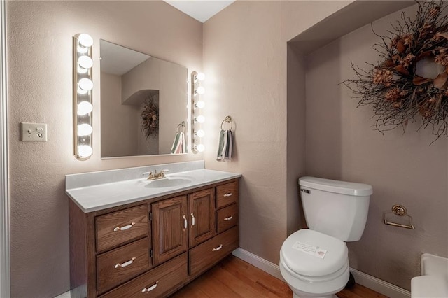246 Coleman St, Chippewa Falls, WI 54729 - half bath featuring wood finished floors and vanity