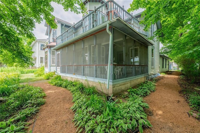 246 Coleman St, Chippewa Falls, WI 54729 - view of side of property featuring a balcony and a sunroom