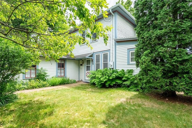 246 Coleman St, Chippewa Falls, WI 54729 - traditional-style home featuring a front lawn