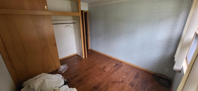 921 S 10th St, Wisconsin Rapids, WI 54494 - unfurnished bedroom featuring wood finished floors and a closet