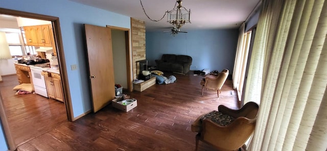 921 S 10th St, Wisconsin Rapids, WI 54494 - living room with dark wood-style floors and a chandelier