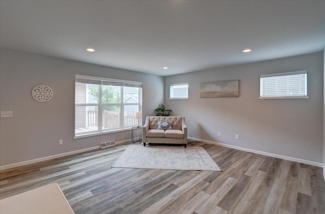 615 Prospect Rd, Waunakee, WI 53597 - living area featuring wood finished floors and recessed lighting