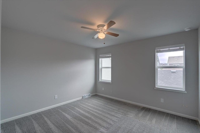 615 Prospect Rd, Waunakee, WI 53597 - spare room featuring ceiling fan, carpet floors, and a smoke detector