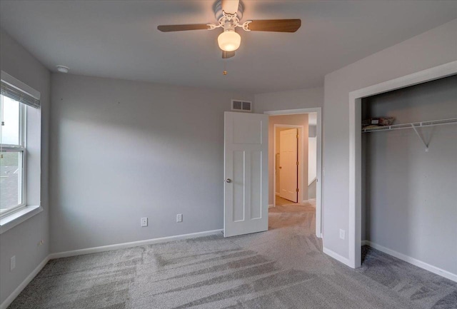 615 Prospect Rd, Waunakee, WI 53597 - unfurnished bedroom with carpet floors, multiple windows, a closet, and a ceiling fan