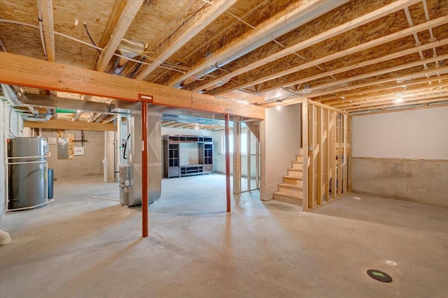 615 Prospect Rd, Waunakee, WI 53597 - unfinished basement featuring water heater, stairway, heating unit, and electric panel