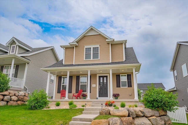 615 Prospect Rd, Waunakee, WI 53597 - view of front of property featuring a porch and a front lawn