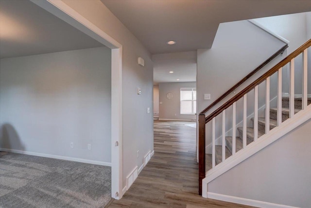 615 Prospect Rd, Waunakee, WI 53597 - staircase with wood finished floors and recessed lighting