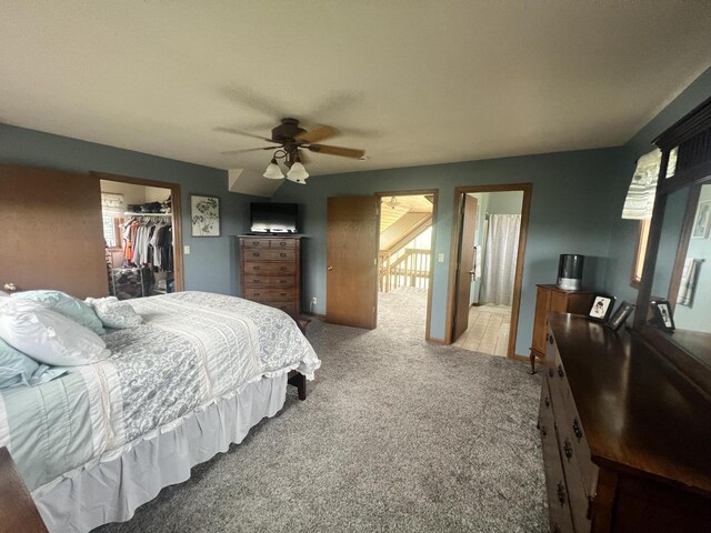 E3577 US Highway 14, Coon Valley, WI 54623 - carpeted bedroom featuring a walk in closet, a closet, and ceiling fan