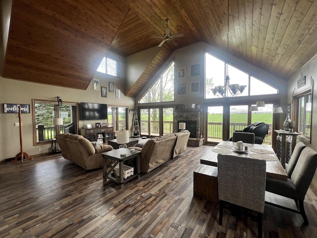 E3577 US Highway 14, Coon Valley, WI 54623 - living area with high vaulted ceiling, a stone fireplace, ceiling fan, dark wood-style floors, and wood ceiling