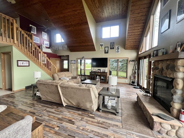 E3577 US Highway 14, Coon Valley, WI 54623 - living room with high vaulted ceiling, a fireplace, stairs, hardwood / wood-style flooring, and ceiling fan