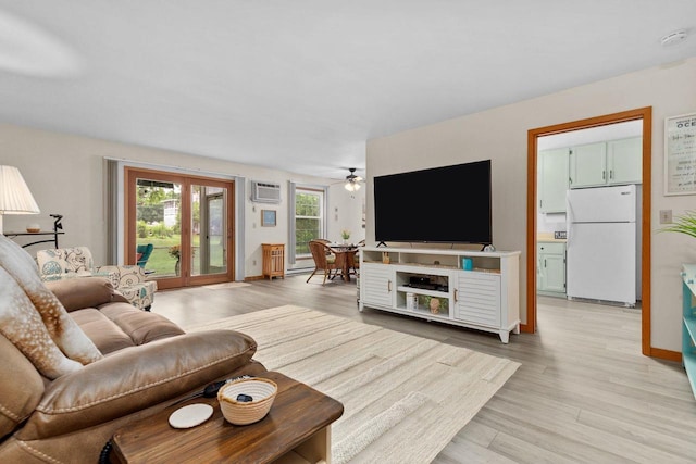 2360 Wisconsin St, Oshkosh, WI 54901 - living area with a wall mounted AC, light wood finished floors, and a ceiling fan