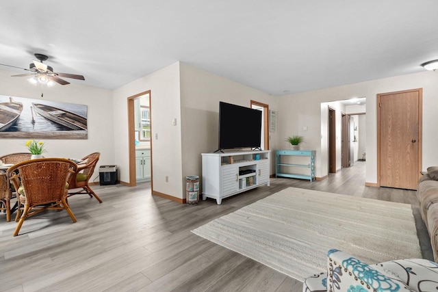 2360 Wisconsin St, Oshkosh, WI 54901 - living area featuring light wood-type flooring and ceiling fan