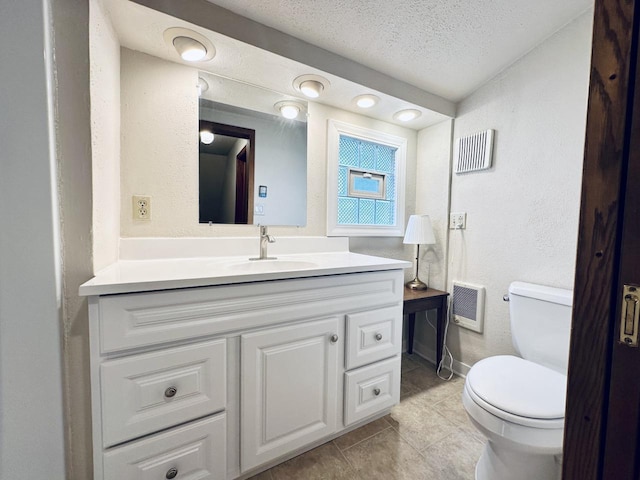 2377 S 76th St, West Allis, WI 53219 - half bathroom with vanity, tile patterned flooring, a textured ceiling, and heating unit