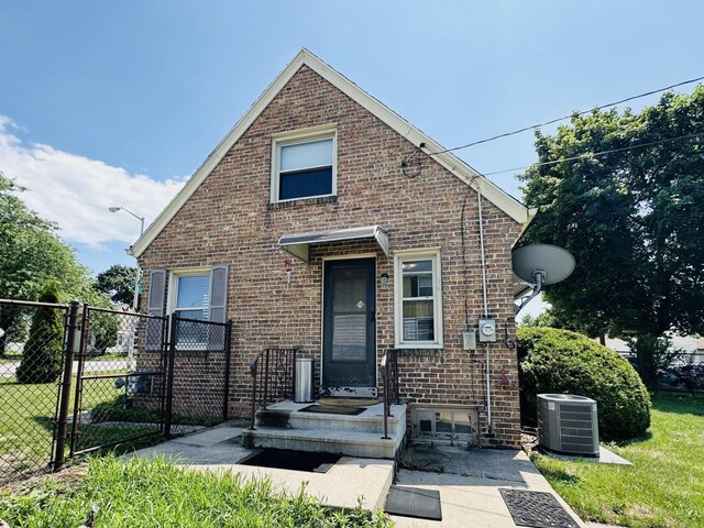 2377 S 76th St, West Allis, WI 53219 - view of front of house featuring brick siding and a gate
