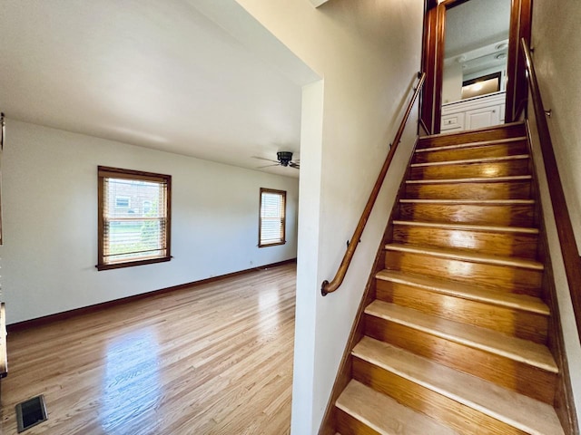 2377 S 76th St, West Allis, WI 53219 - stairway with wood finished floors and a ceiling fan