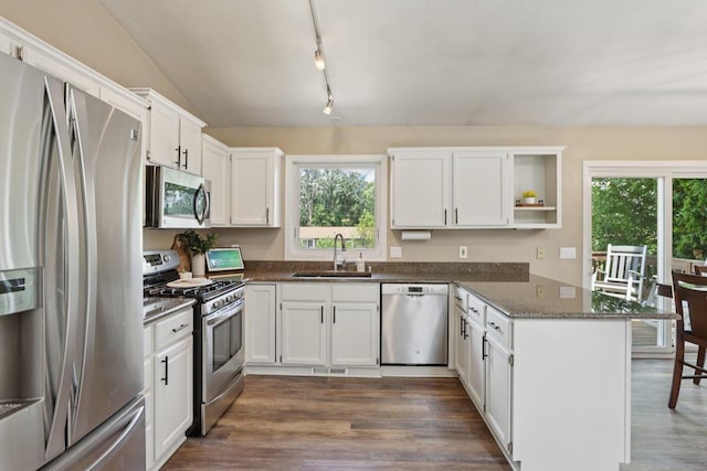 5538 Galway Dr, Waunakee, WI 53597 - kitchen with stainless steel appliances, open shelves, a peninsula, and plenty of natural light