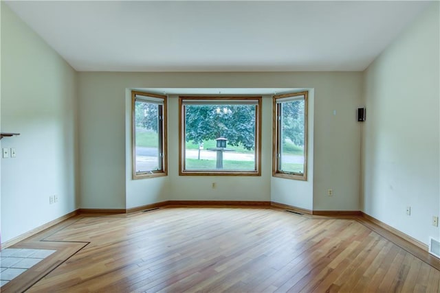 1634 Nicholas Dr, Eau Claire, WI 54703 - empty room featuring light wood-type flooring and baseboards