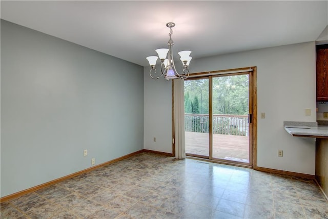 1634 Nicholas Dr, Eau Claire, WI 54703 - unfurnished dining area with baseboards and a chandelier