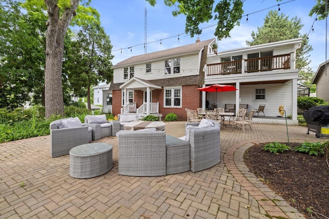 415 S Lake Shore Dr, Lake Geneva, WI 53147 - back of house featuring an outdoor living space, a balcony, and a patio