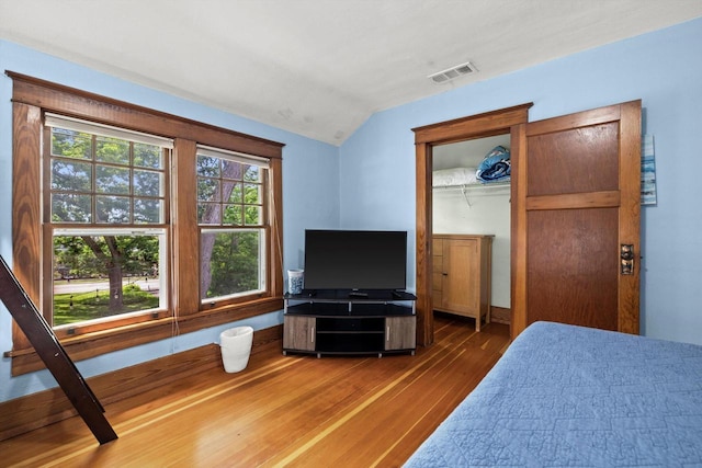 415 S Lake Shore Dr, Lake Geneva, WI 53147 - bedroom with wood-type flooring, vaulted ceiling, and a closet