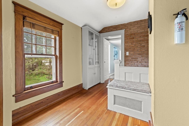 415 S Lake Shore Dr, Lake Geneva, WI 53147 - hallway featuring vaulted ceiling, light wood finished floors, and healthy amount of natural light