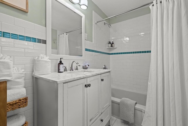 415 S Lake Shore Dr, Lake Geneva, WI 53147 - full bath with tile walls, vanity, and shower / bath combination with curtain