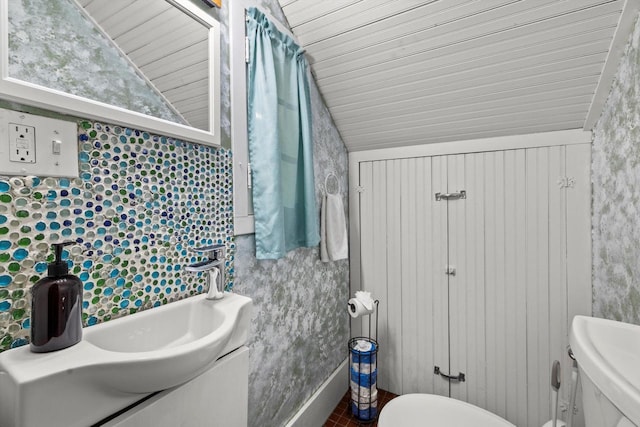415 S Lake Shore Dr, Lake Geneva, WI 53147 - half bath with lofted ceiling, vanity, tile patterned floors, and wood ceiling