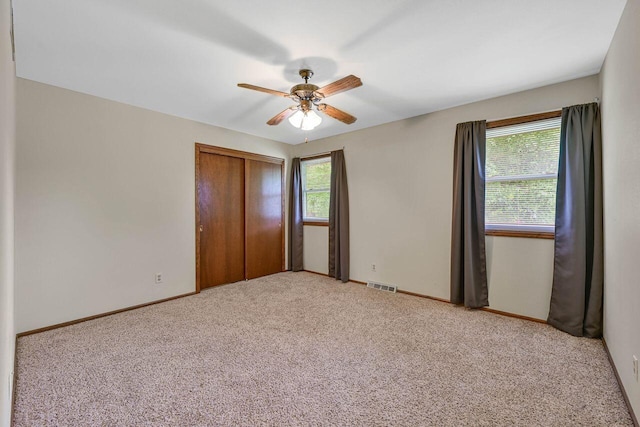 3948 S 72nd St, Milwaukee, WI 53220 - unfurnished bedroom featuring multiple windows, carpet flooring, and a closet
