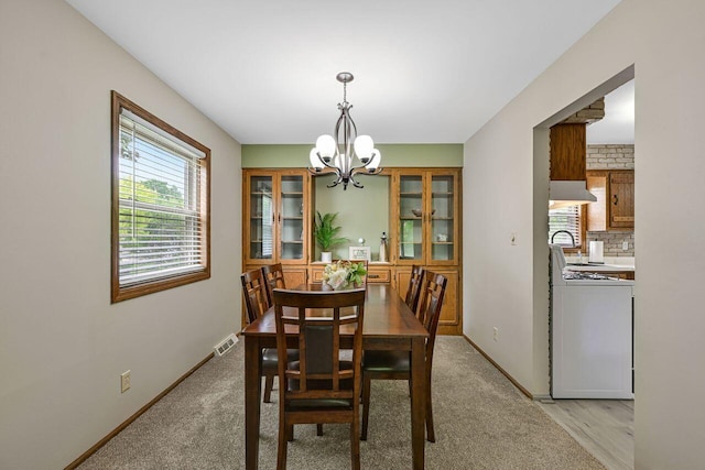 3948 S 72nd St, Milwaukee, WI 53220 - dining space featuring a chandelier and baseboards