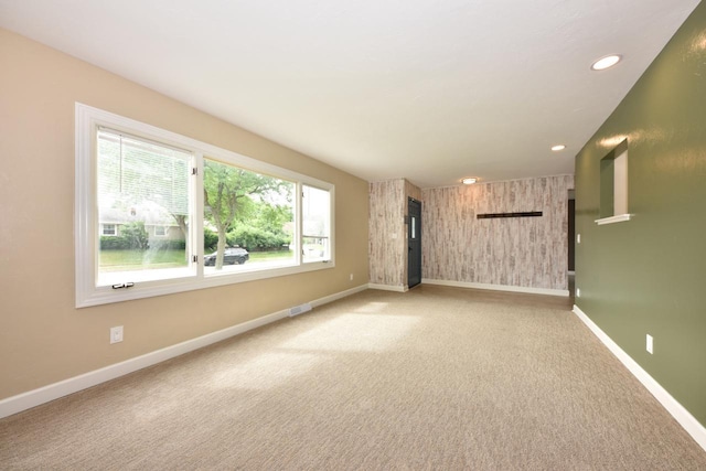 1232 Lambeth Rd, Waukesha, WI 53189 - spare room featuring light carpet and recessed lighting