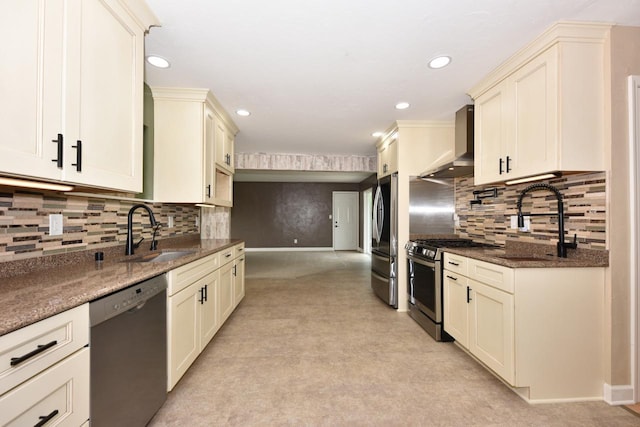 1232 Lambeth Rd, Waukesha, WI 53189 - kitchen featuring appliances with stainless steel finishes, wall chimney exhaust hood, recessed lighting, backsplash, and cream cabinets