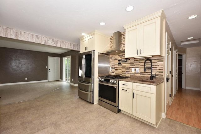 1232 Lambeth Rd, Waukesha, WI 53189 - kitchen with appliances with stainless steel finishes, wall chimney range hood, cream cabinets, dark stone counters, and recessed lighting