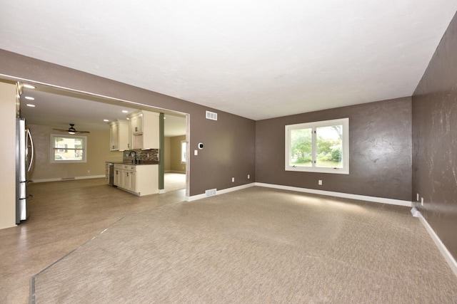 1232 Lambeth Rd, Waukesha, WI 53189 - unfurnished living room with baseboards