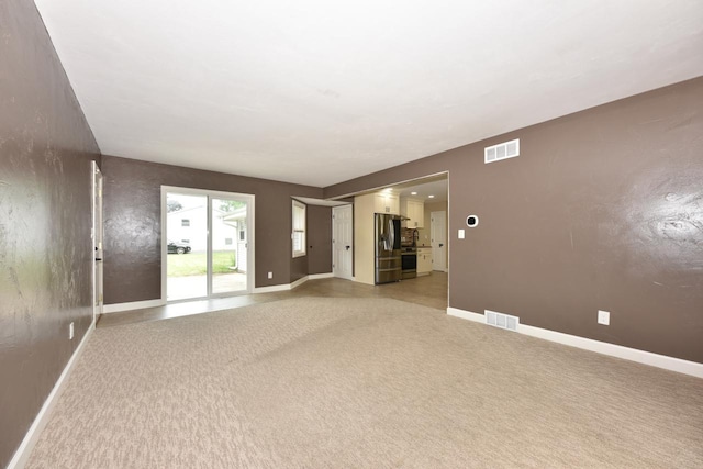 1232 Lambeth Rd, Waukesha, WI 53189 - unfurnished room featuring baseboards and light carpet