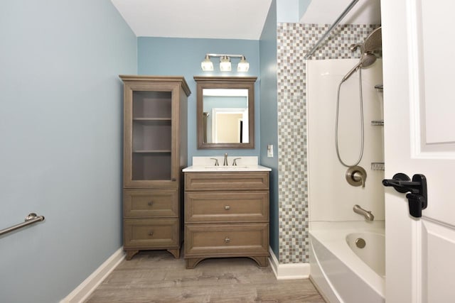 1232 Lambeth Rd, Waukesha, WI 53189 - full bath with shower / washtub combination, vanity, and wood finished floors
