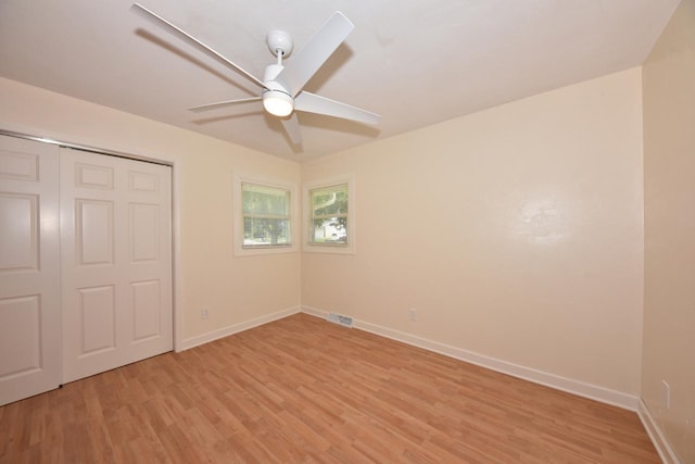 1232 Lambeth Rd, Waukesha, WI 53189 - unfurnished bedroom with light wood-type flooring, a closet, and a ceiling fan