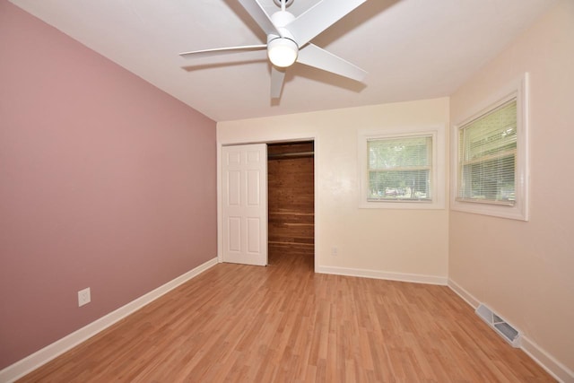 1232 Lambeth Rd, Waukesha, WI 53189 - unfurnished bedroom with light wood-style floors, a closet, and a ceiling fan