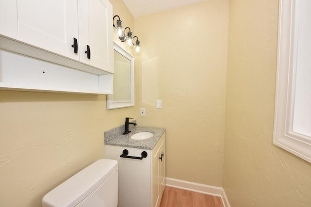 1232 Lambeth Rd, Waukesha, WI 53189 - half bathroom with vanity and wood finished floors