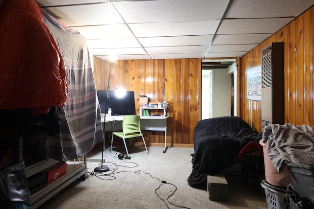 8761 W Herbert Ave, Milwaukee, WI 53225 - living area featuring wooden walls, carpet flooring, and a drop ceiling
