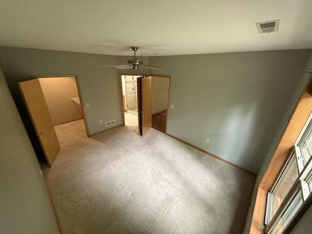 N82W13370 Fond Du Lac Ave Unit 101, Menomonee Falls, WI 53051 - unfurnished bedroom with light colored carpet and a ceiling fan
