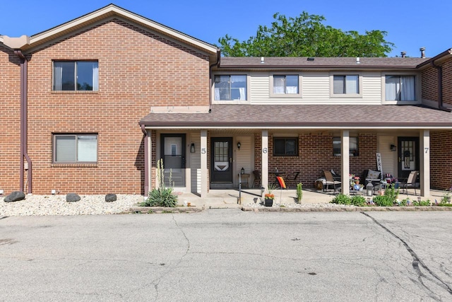 5640 Cambridge Ln Unit 5, Mount Pleasant, WI 53406 - townhome / multi-family property with brick siding and a porch