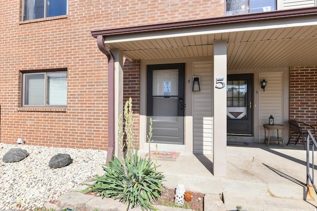 5640 Cambridge Ln Unit 5, Mount Pleasant, WI 53406 - doorway to property with brick siding