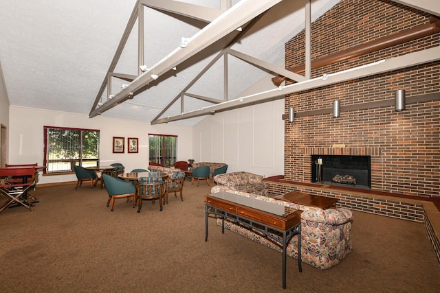 5640 Cambridge Ln Unit 5, Mount Pleasant, WI 53406 - carpeted living area with high vaulted ceiling and a fireplace