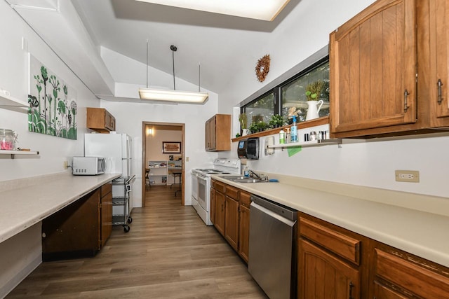 5640 Cambridge Ln Unit 5, Mount Pleasant, WI 53406 - kitchen with appliances with stainless steel finishes, lofted ceiling, wood finished floors, light countertops, and brown cabinetry